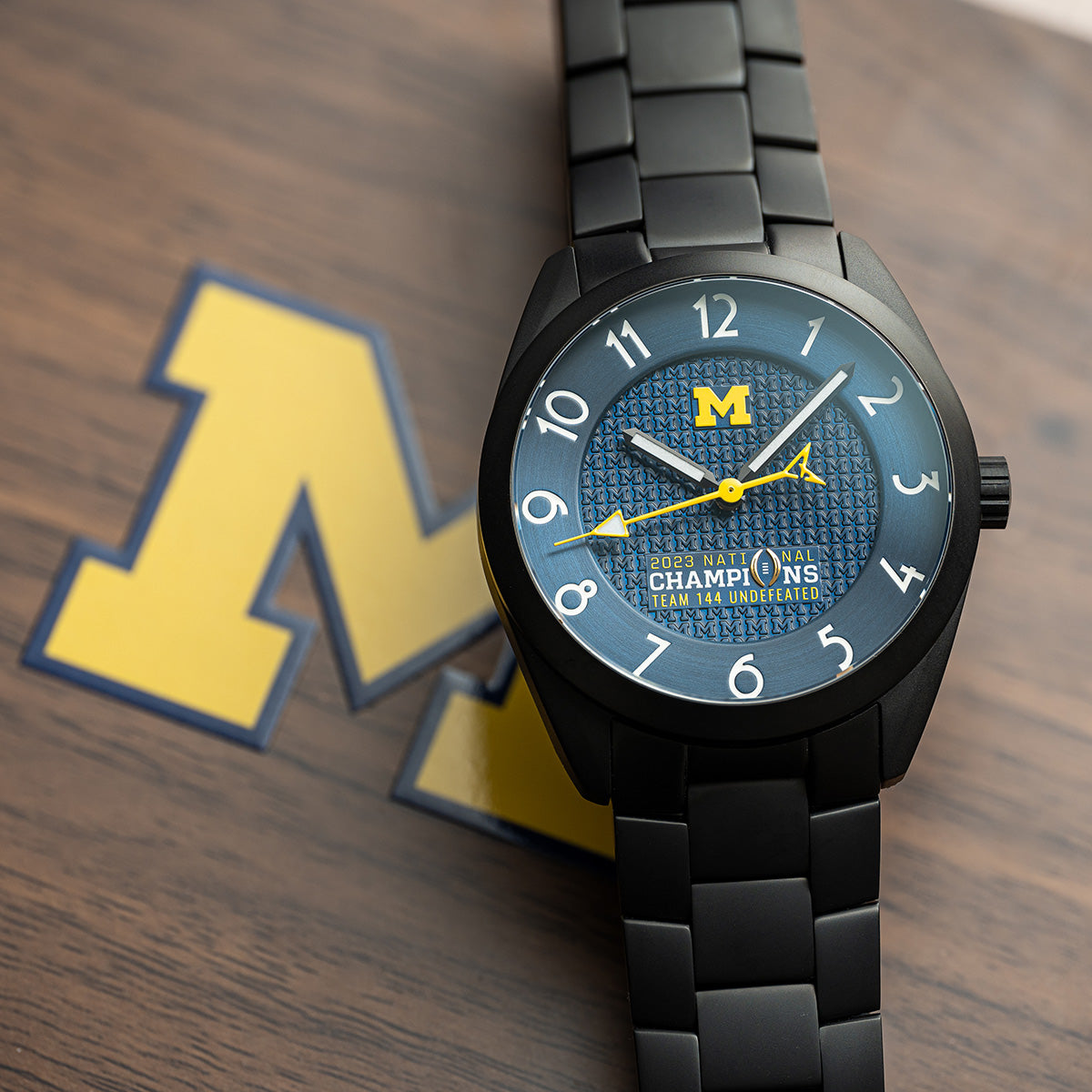 Michigan 2023 National Champions Black PVD Kairos II CFP 2024 swiss made automatic watch. Black PVD bracelet. Front view on closed box.