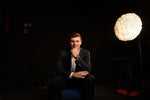 Fernando Mendoza seated in a dark studio, wearing a navy blazer and the Indiana Heisman ARGOS watch on his wrist, photographed during an AXIA Time interview in February 2026 as he prepared for the NFL Draft