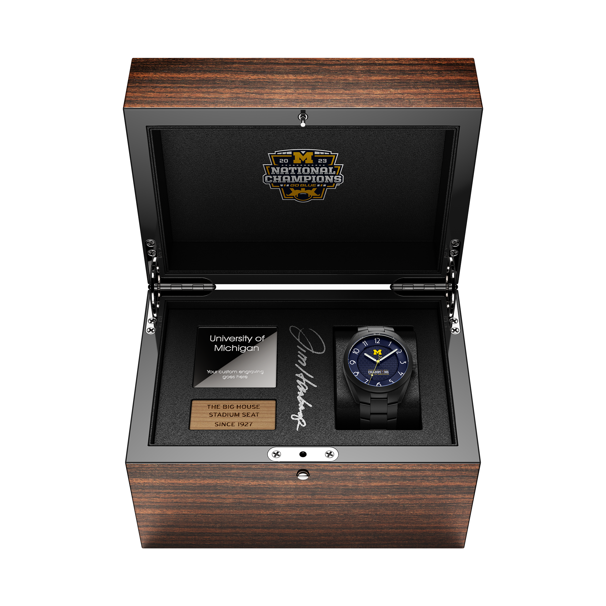 2023 Michigan National Champions Jim Harbaugh autographed display box with the Kairos II Swiss made automatic watch in black PVD and a piece of wood from The Big House stadium seats originally installed in 1927.