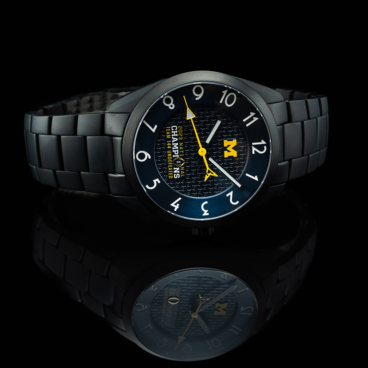 Michigan 2023 National Champions Black PVD Kairos II CFP 2024 swiss made automatic watch. Black PVD bracelet. Mirror table view.