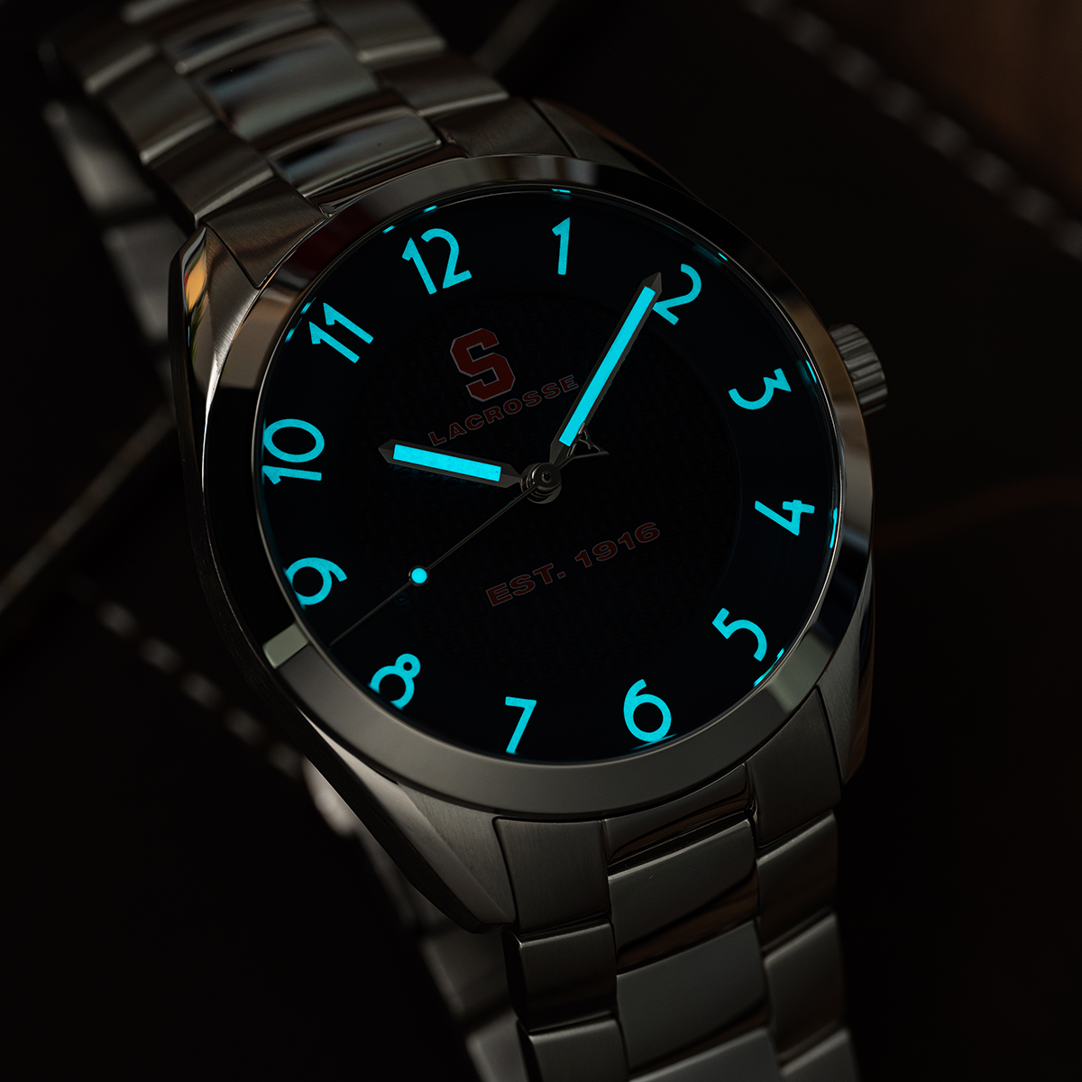 Syracuse lacrosse Swiss made automatic watch. Lume view showing glow-in-the-dark capability..