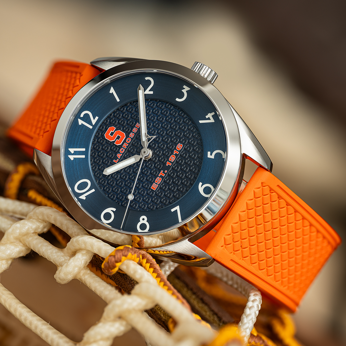 Syracuse lacrosse Swiss made automatic watch. Table view on net with color-matched rubber strap.