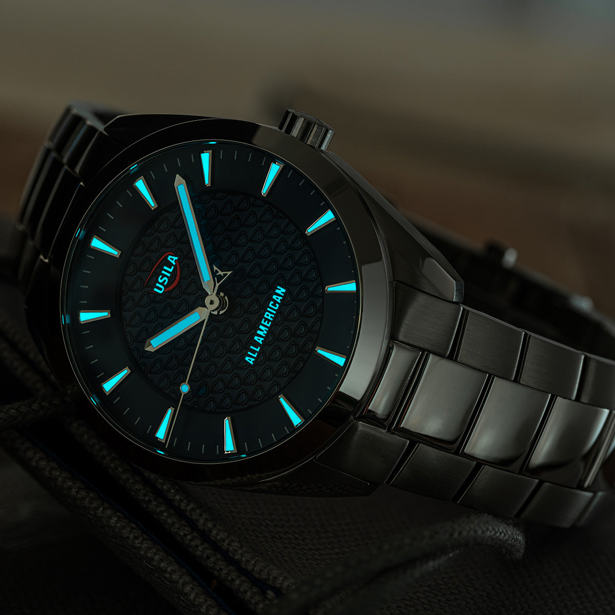 USILA All American Kairos II Swiss made automatic watch with stainless steel bracelet. Lume view.