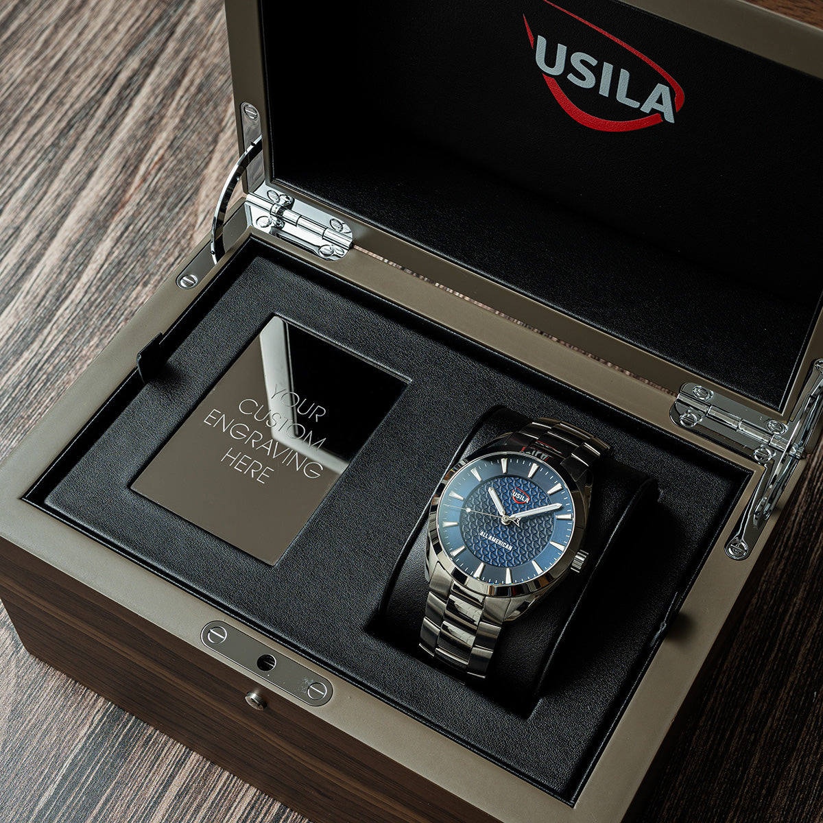 USILA All American Kairos II Swiss made automatic watch in wood display box, open view. Stainless steel bracelet.