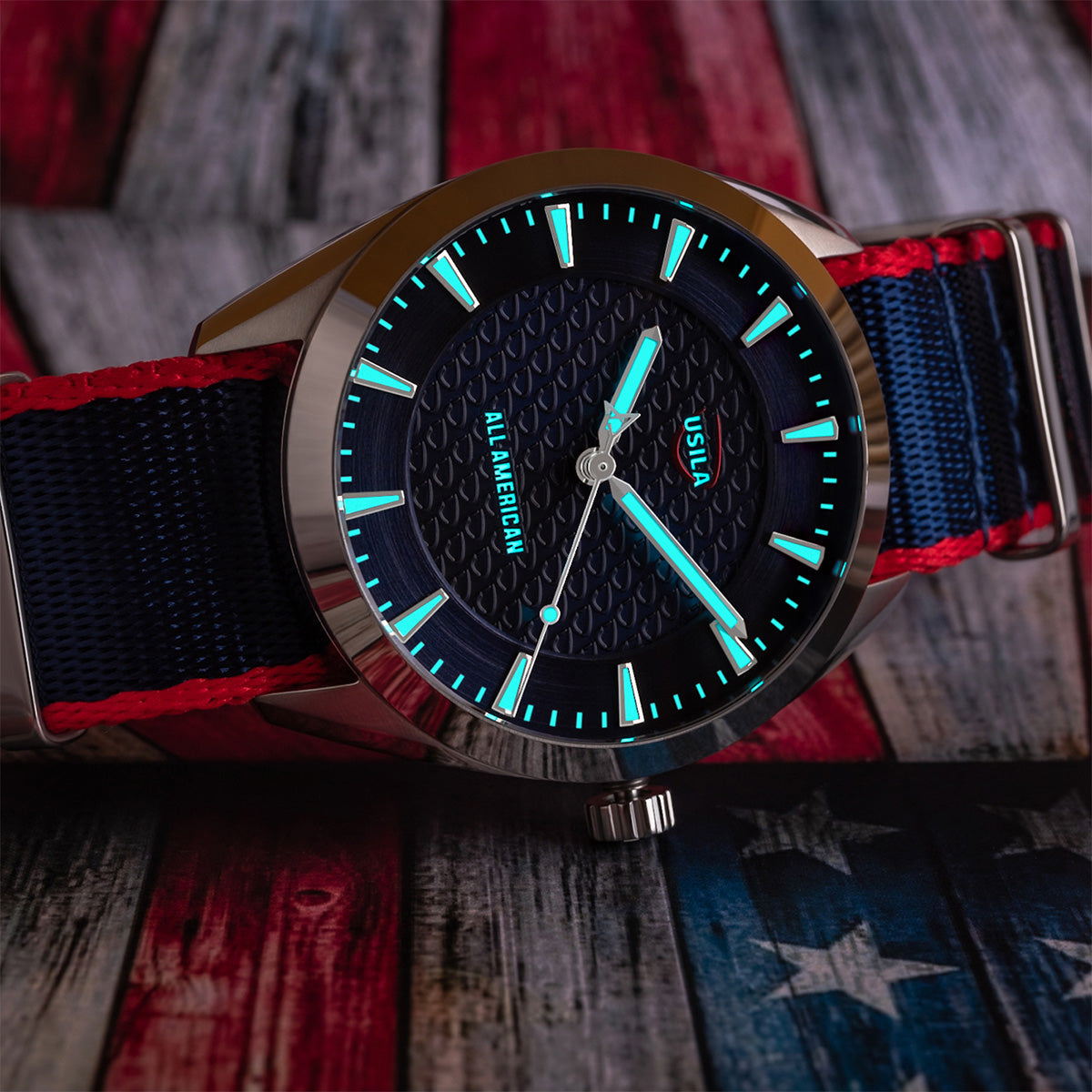 USILA All American Kairos II Swiss made automatic watch. Table view NATO strap. Lume view.