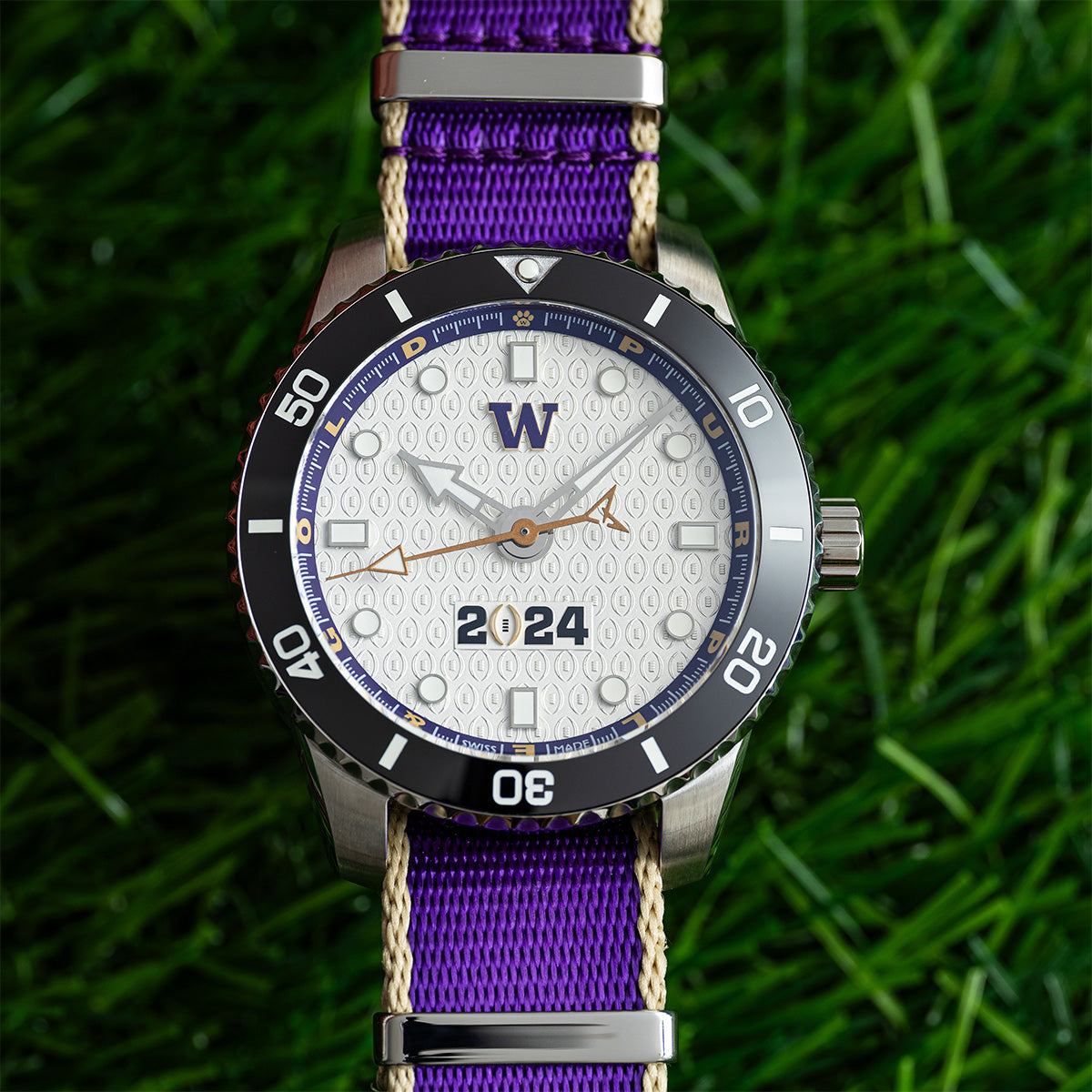 CFP 2024 Washington Huskies Odysseus swiss made automatic watch. NATO strap on grass.